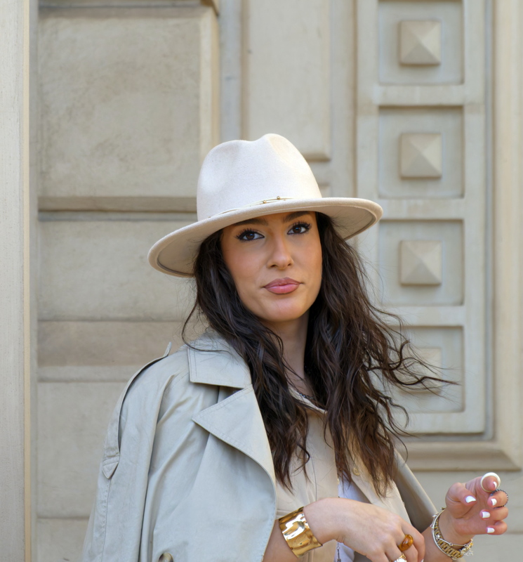 Young woman near a building wall